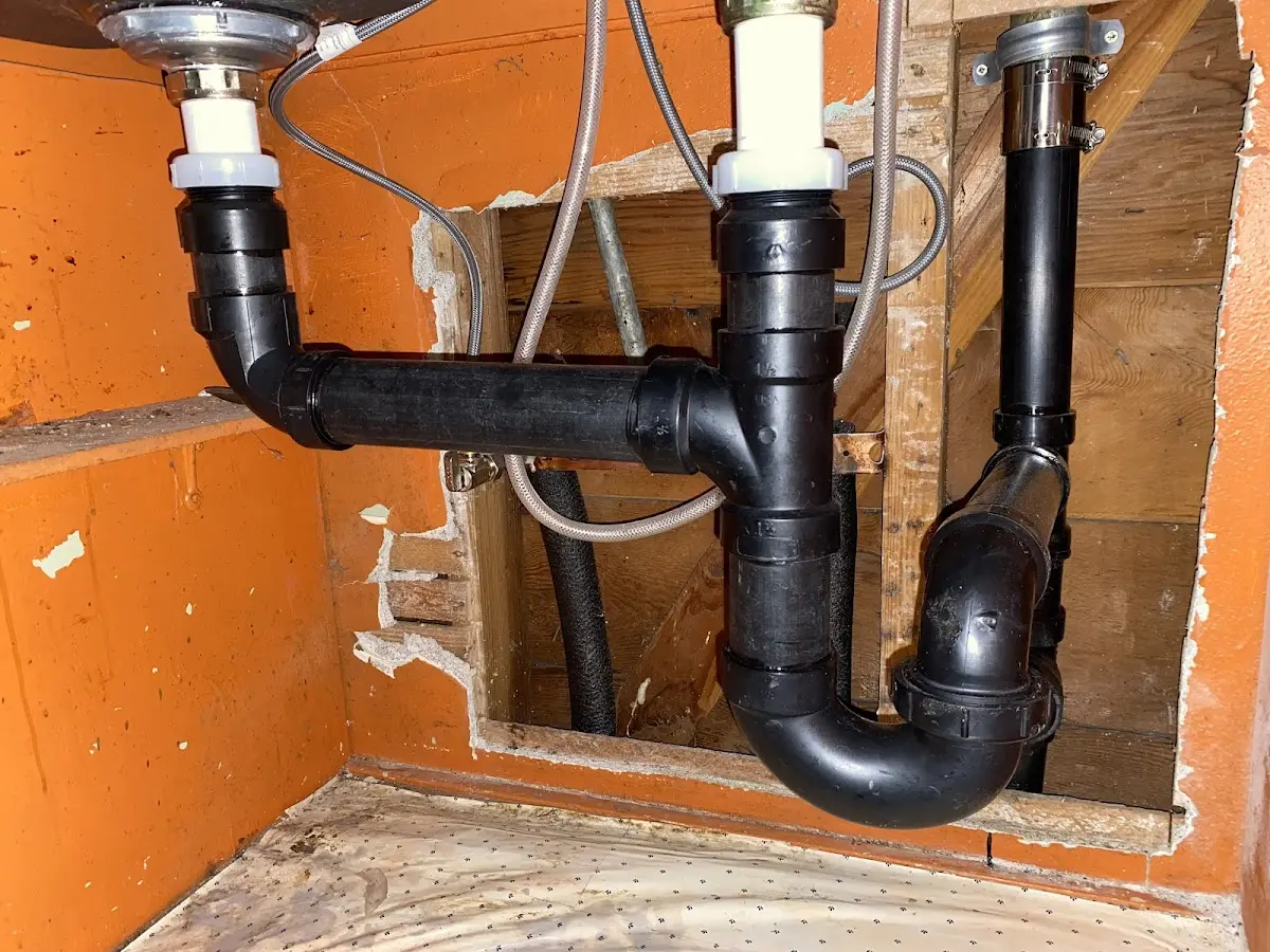 Professional Garbage Disposal Repair equipment and tools on the job in Amityville